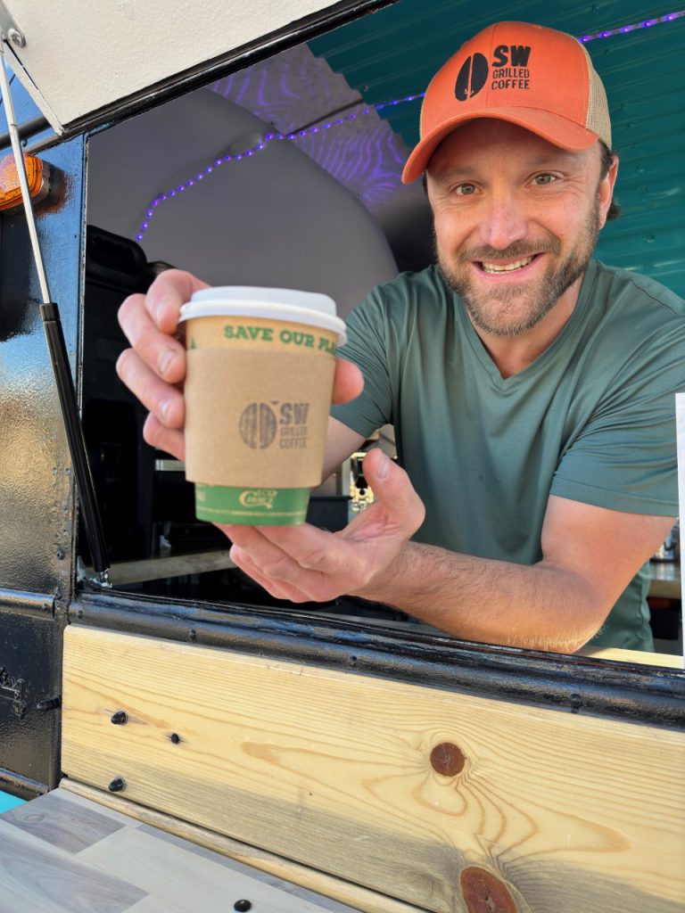 Taylor Kirkman of SW Grill roasted coffee serving coffee out of the coffee caboose