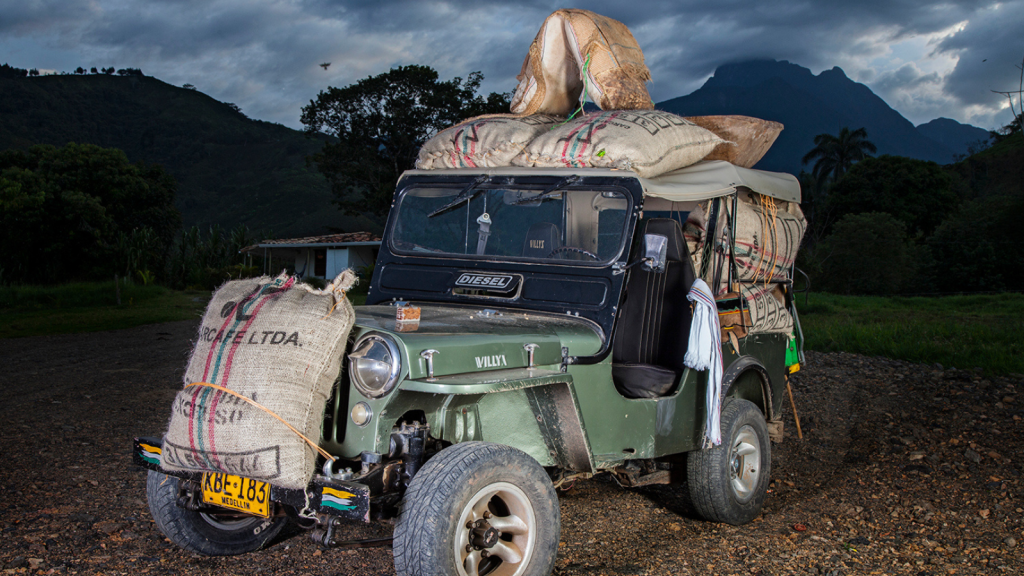 Jeep in Colombia with jute bags full of Colombian coffee strapped on