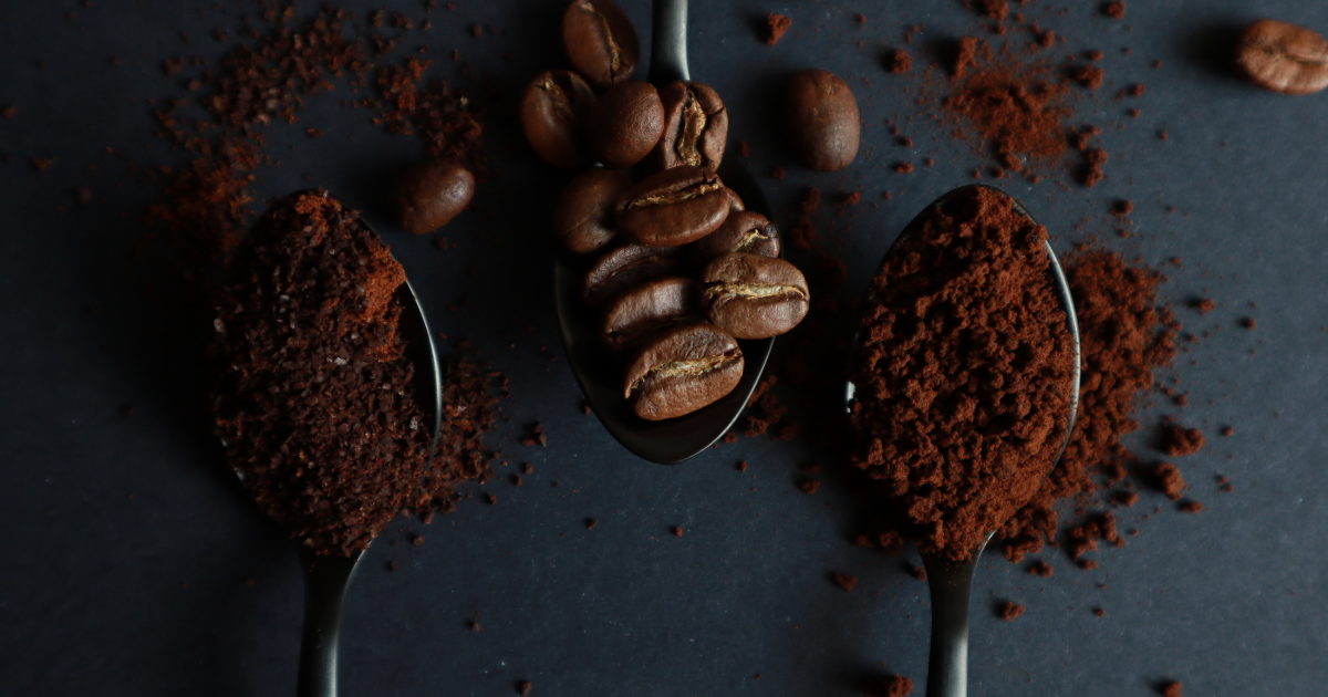 Different coffee grind sizes along with whole bean coffee