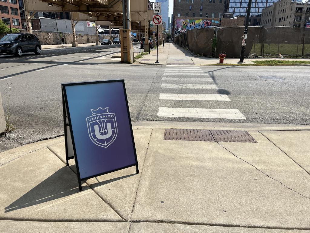 Unrivaled sign at the corner of a street in Chicago's West Loop