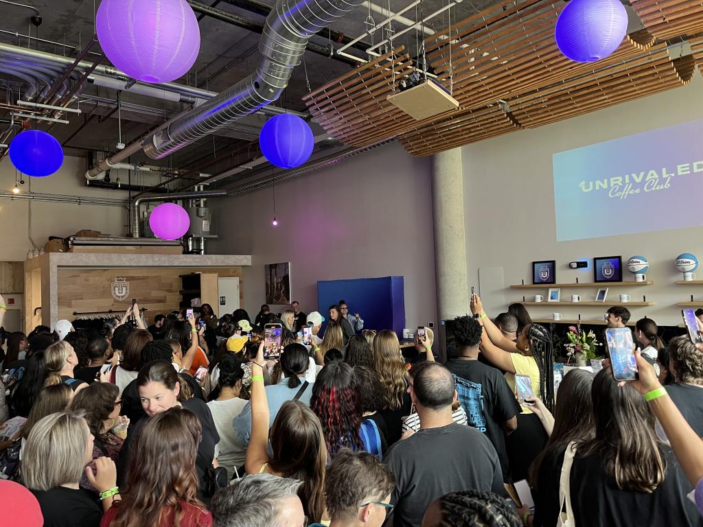 A crowd inside of a cafe for Unrivaled Coffee Club event 