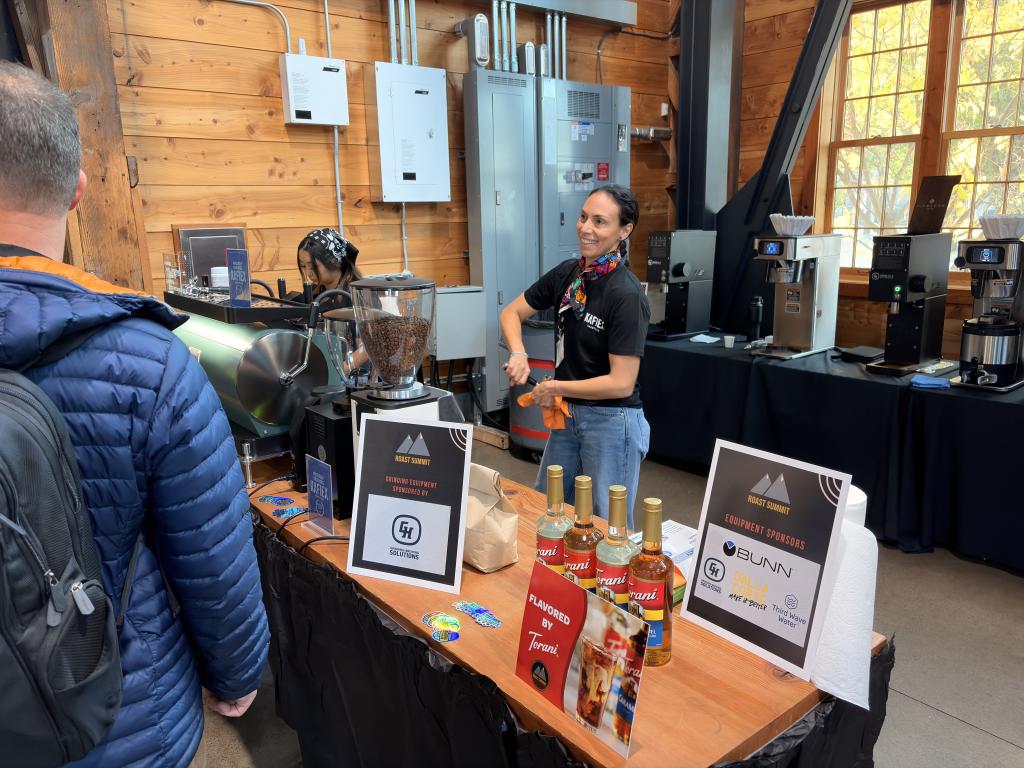 Seidy Selivanow of Kafiex serving espresso at Roast Summit Portland 2026